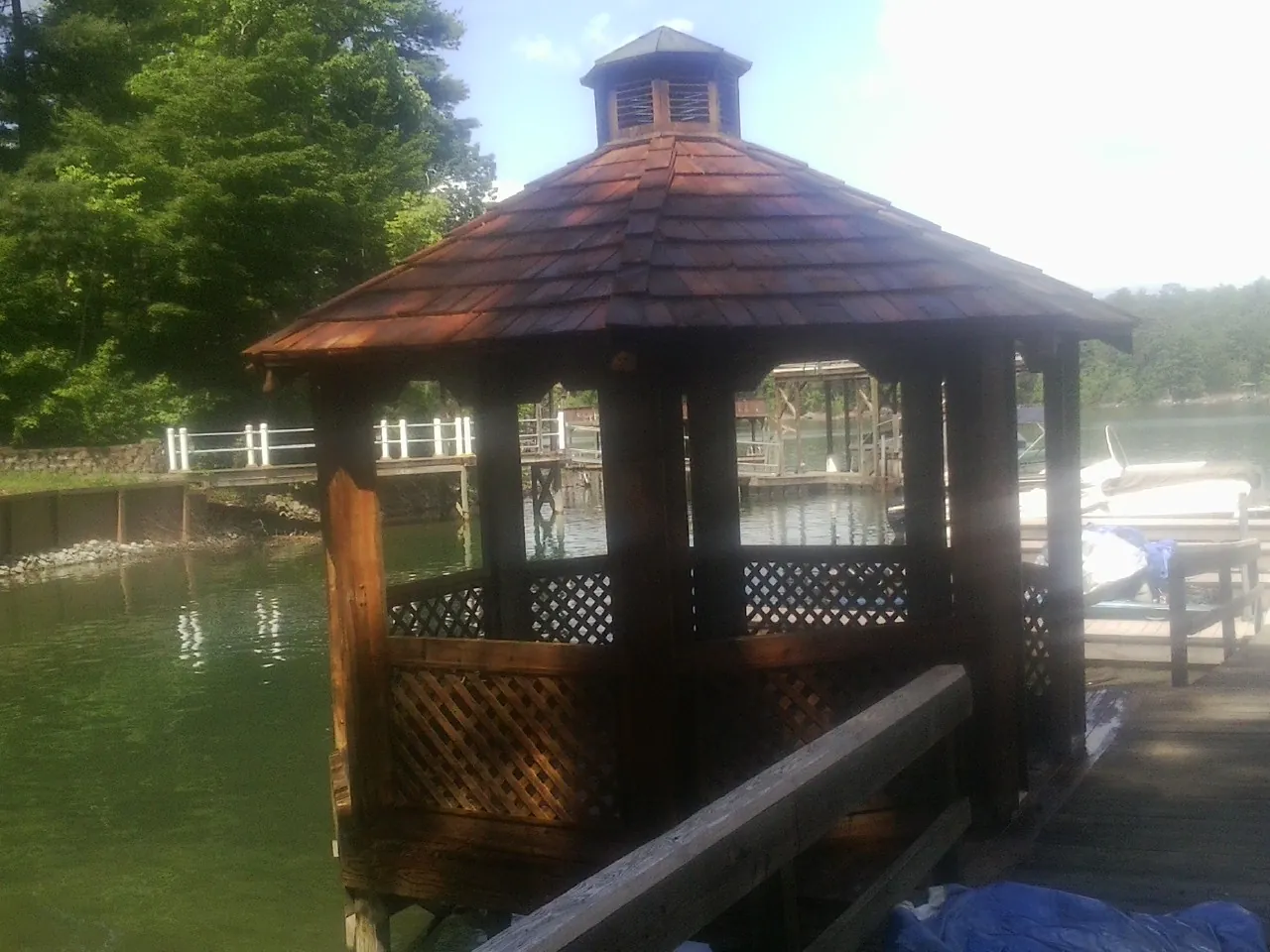 Cedar shake gazebo roof rebuilt on a lake dock in Berlin